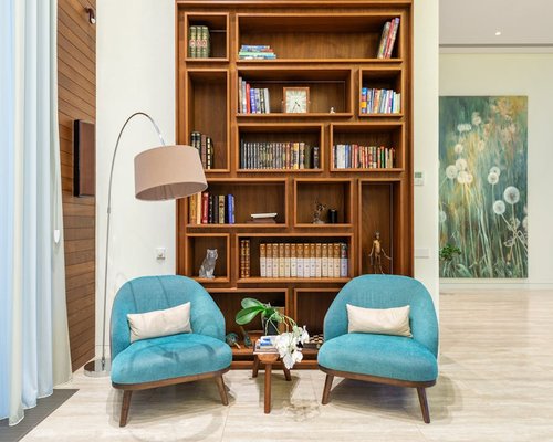 Organized reading corner with a comfortable chair